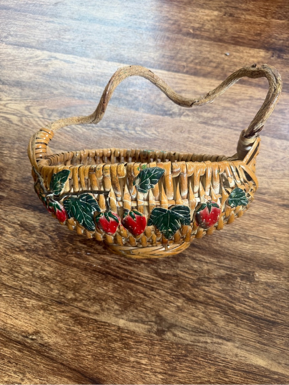 Vintage woven wicker strawberry basket with vine handle